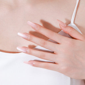 Close-up of Nude Blossom PMMA acrylic long oval nude press-on nails