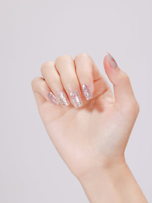 Close-up of Blushing Belle nude pink press-on nails in wearable length