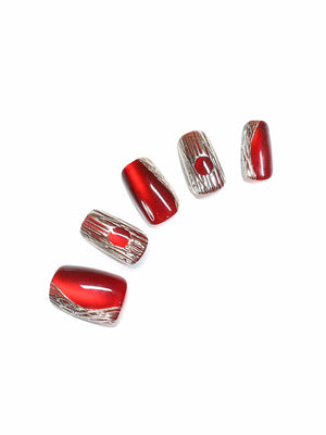 Ruby Flux short square ruby red chrome press-on nails with molten gold accents