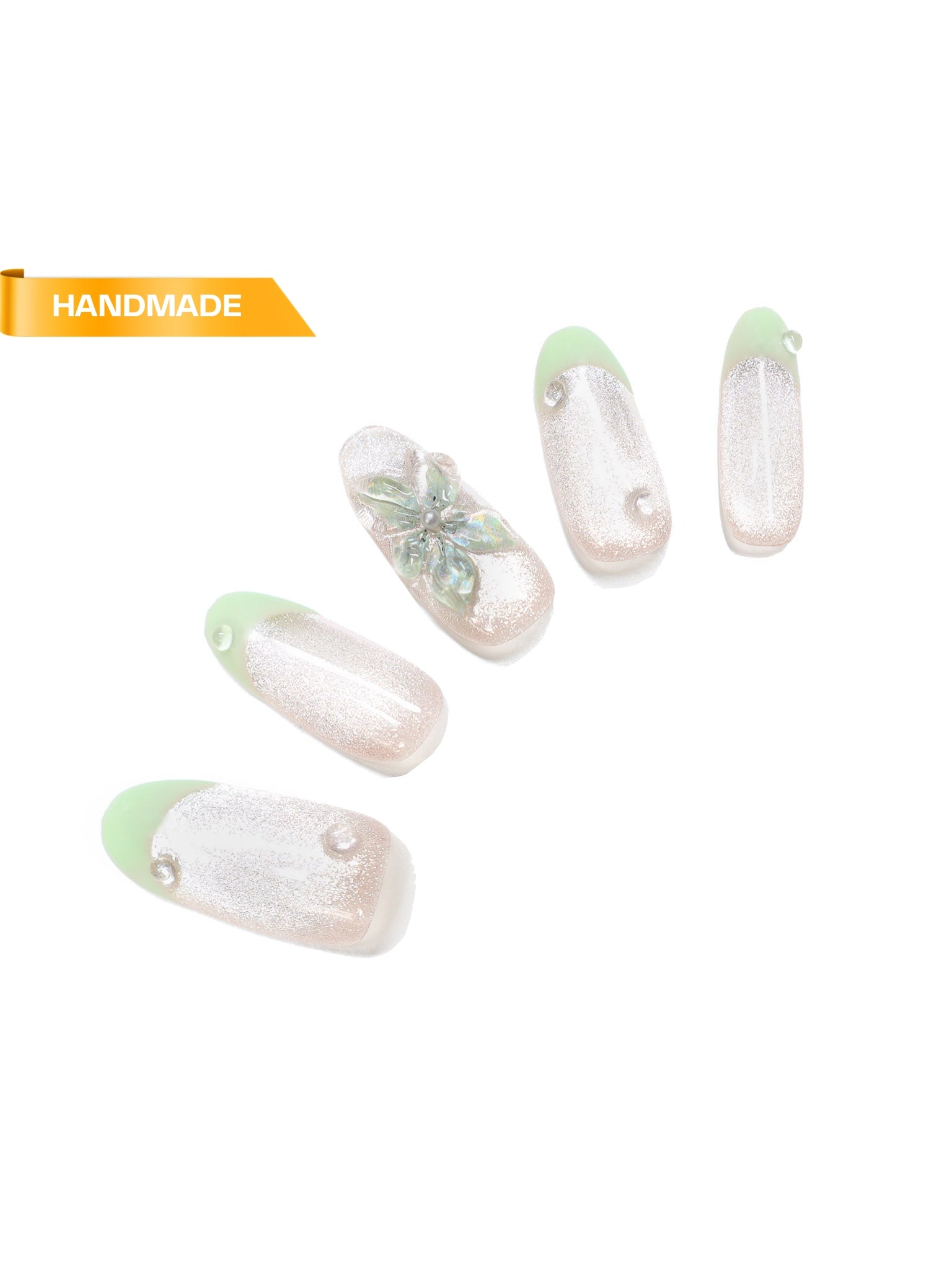 Handmade almond press-on nails with mint green French tips, pearlescent shimmer, and 3D flower accent on white background