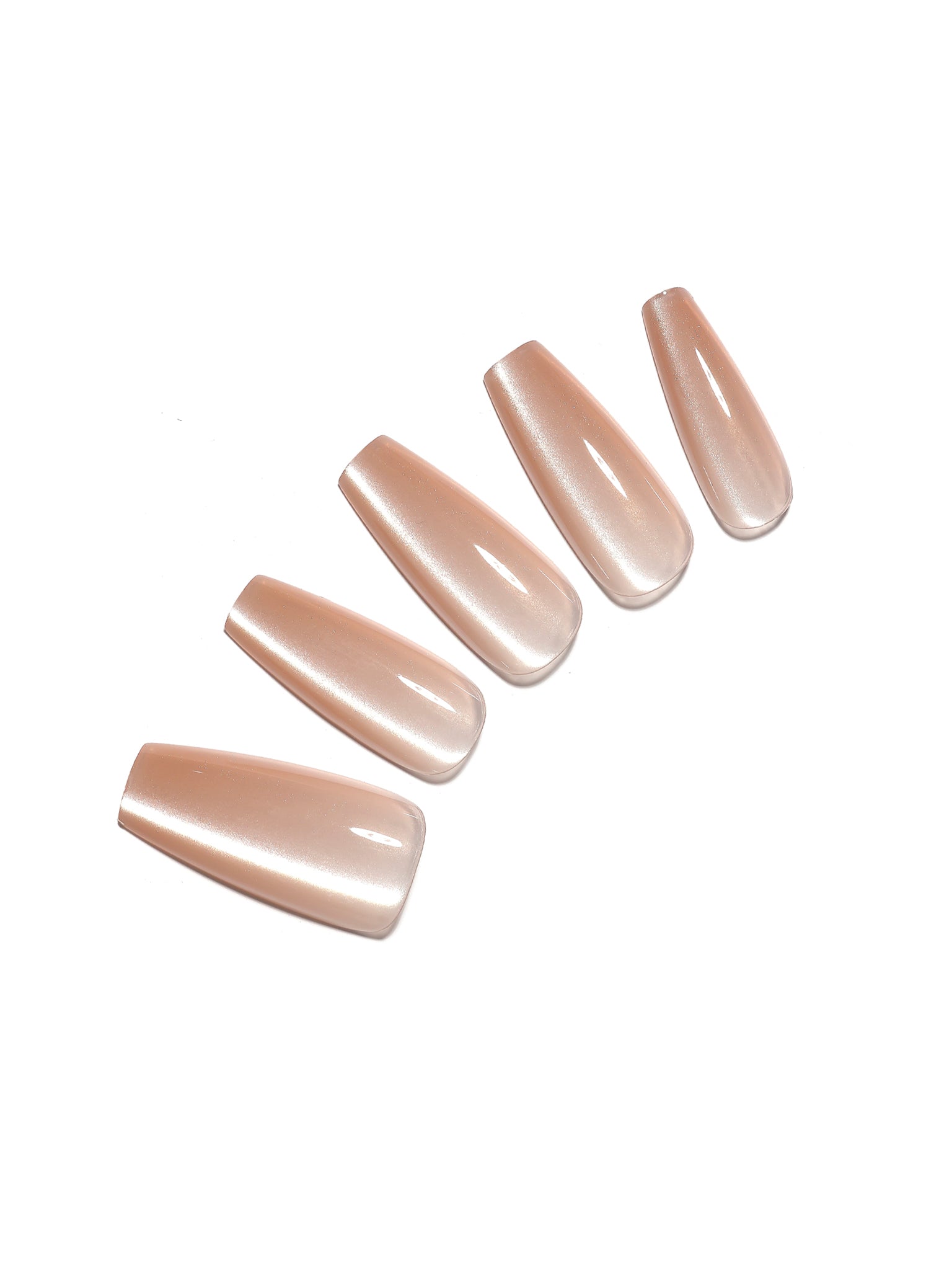Set of nude-colored nail extensions on a white background