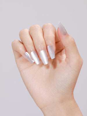 Hand wearing Ice Cold long coffin icy silver white shimmer press-on nails