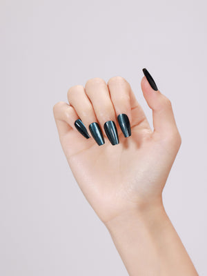 Hand wearing Midnight Kiss long coffin midnight blue metallic press-on nails