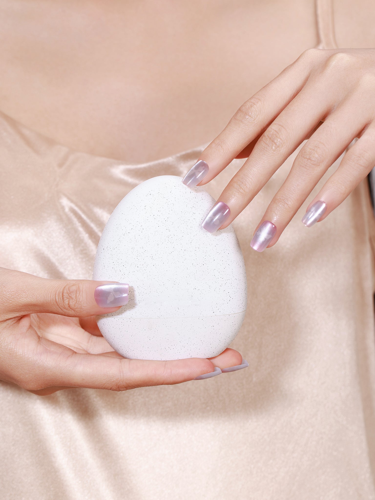 Hand wearing Frosted Butterfly pastel butterfly French press on nails with soft glitter finish