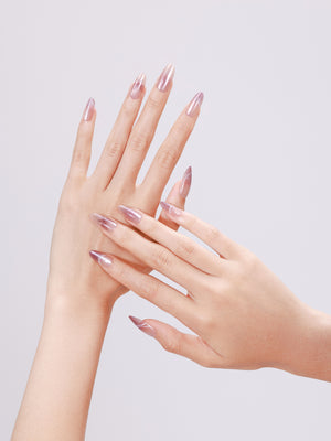 Close-up Butterfly Kiss blush chrome press-on nails with butterfly line art accent nail