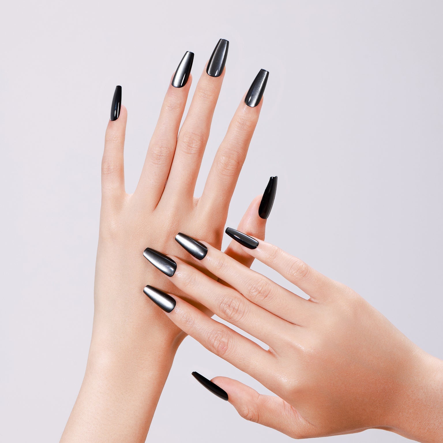 Both hands showing Dark Platinum long coffin black metallic press-on nails