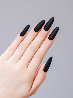 Close-up of long oval matte black PMMA acrylic press-on nails from ShadePax