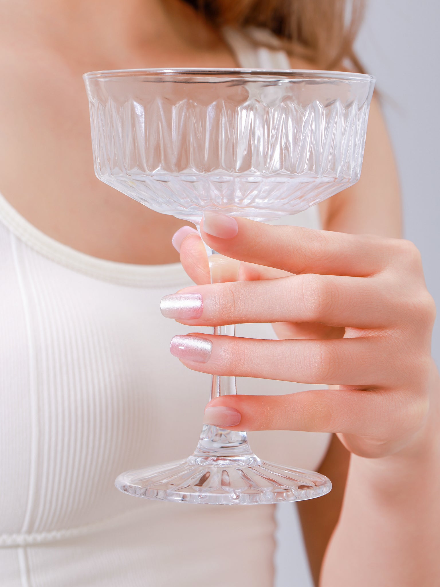 Closeup of Peach Slush PMMA acrylic square press-on nails in peach and candy tones