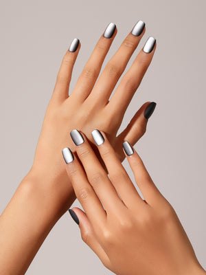 Hand wearing gray matte square press-on nails in an easy everyday length