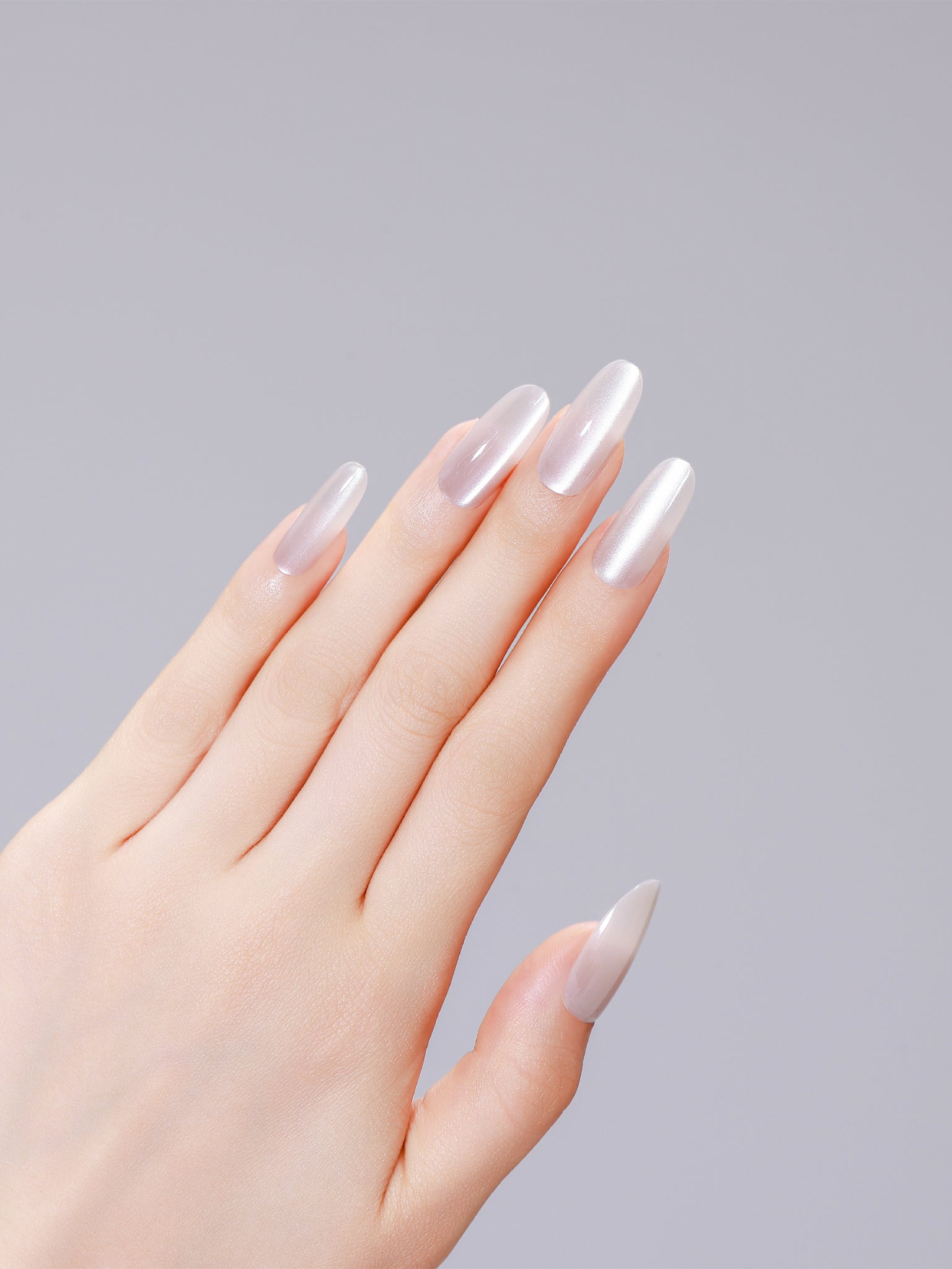 Long oval neutral off-white sand press-on nails with glossy gel finish