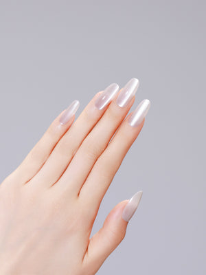 Long oval neutral off-white sand press-on nails with glossy gel finish