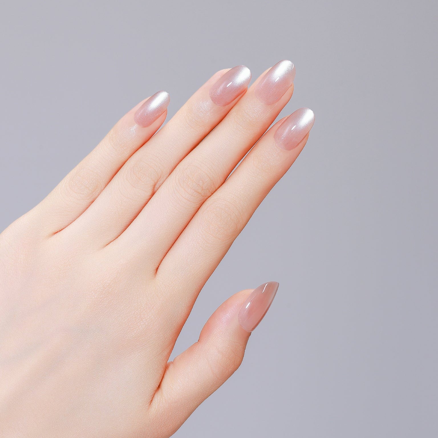 Close-up of Latte Dust PMMA acrylic oval latte pink press-on nails