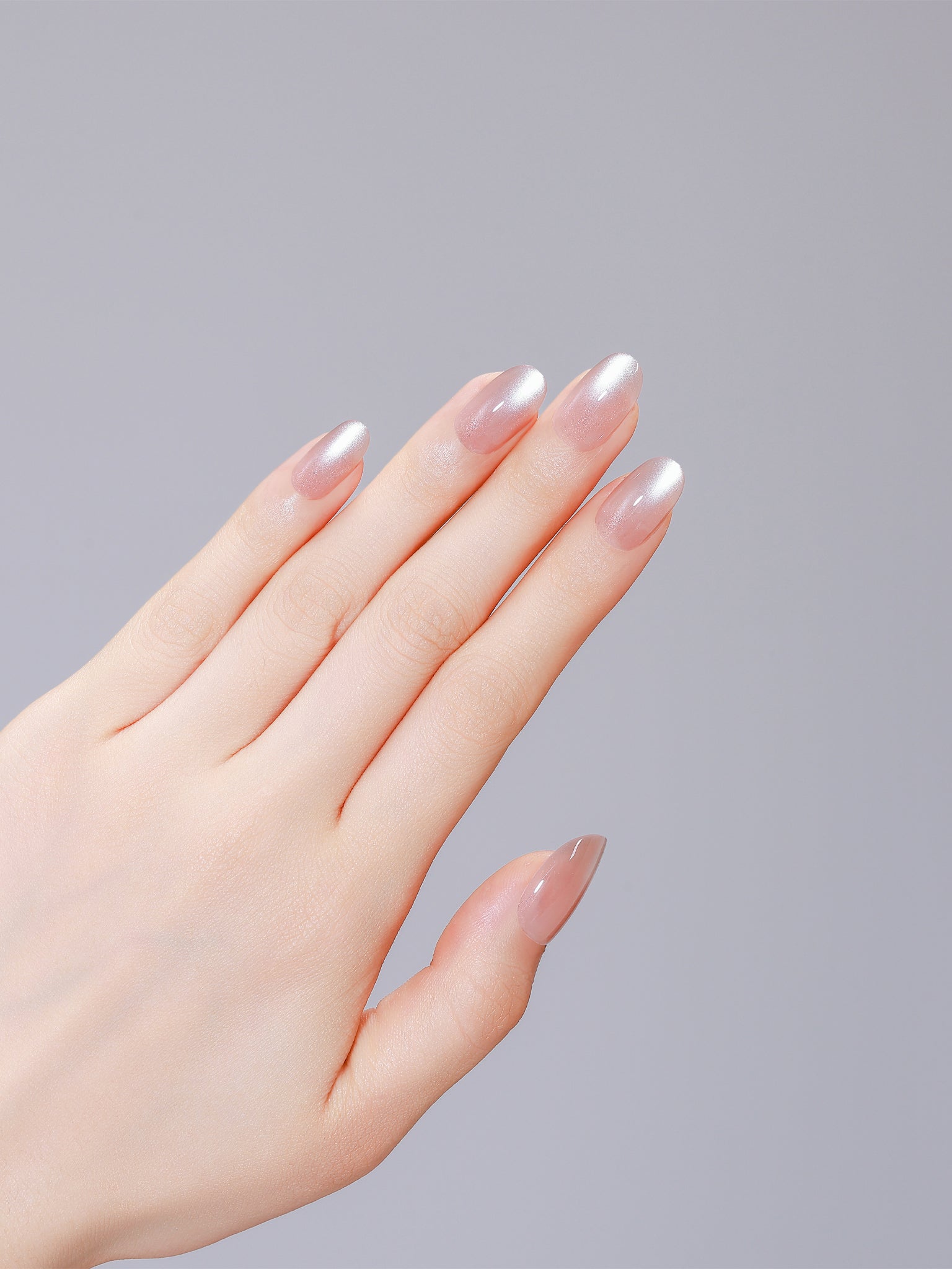 Close-up of Latte Dust PMMA acrylic oval latte pink press-on nails