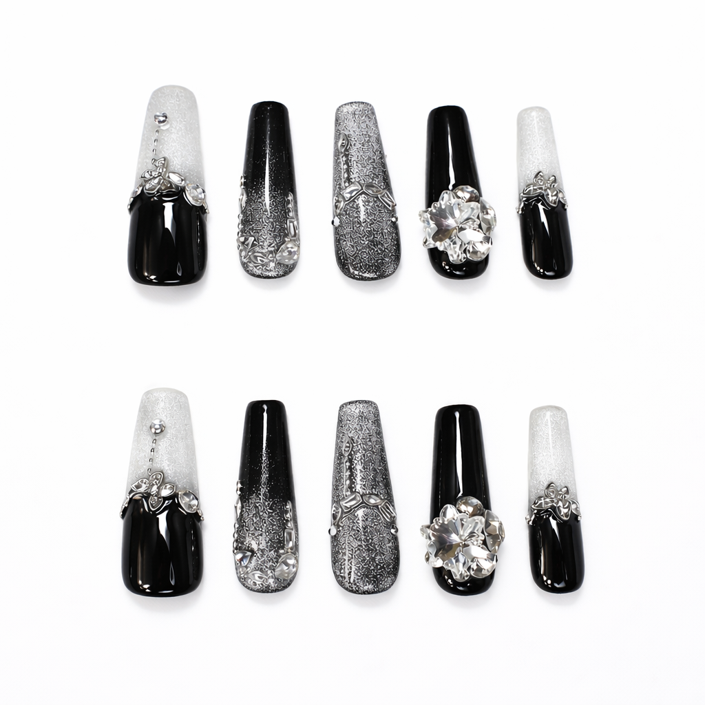 Set of black and silver coffin press on nails featuring glitter ombre, rhinestone details, metallic texture and 3D crystal flower accent
