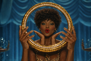 Glossy leopard print press on nails featuring brown and black animal pattern shown on hands, bold statement nail design