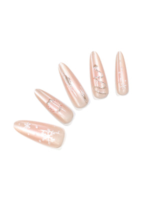 Winter Glow long stiletto nude champagne shimmer press-on nails with snowflake and Christmas tree nail art 30-piece set