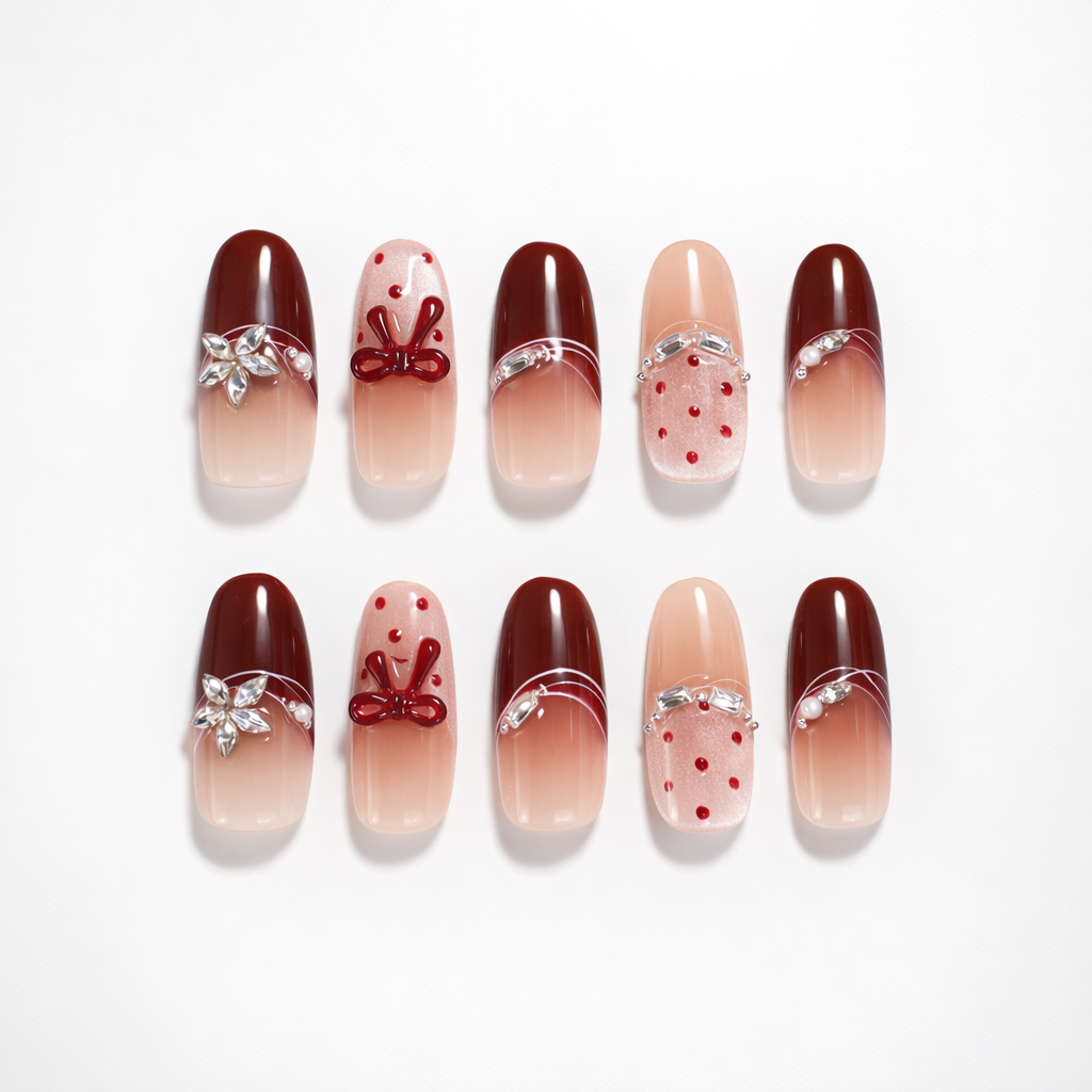 ShadePax burgundy and nude ombré short square press-on nails set with 3D red bow accents, silver rhinestone curves, pearl detail, and red polka dot glitter accent nails on white background.