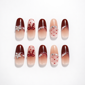 ShadePax burgundy and nude ombré short square press-on nails set with 3D red bow accents, silver rhinestone curves, pearl detail, and red polka dot glitter accent nails on white background.